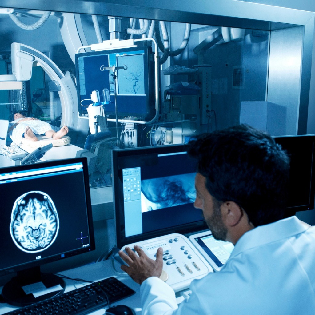 A healthcare worker completes a fluoroscopy procedure.