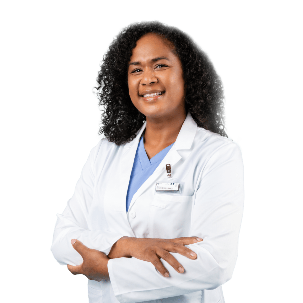 A healthcare worker wearing a white coat with a dosimeter badge.