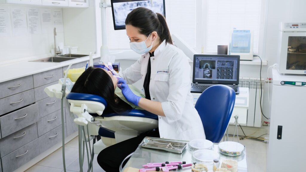 A dentist completes a routine exam with a patient.