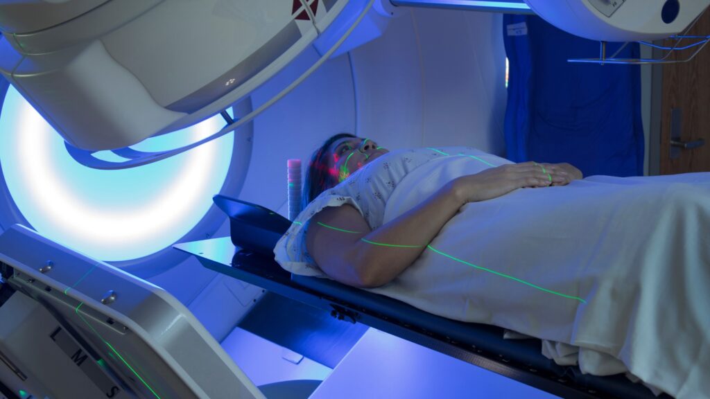 A woman lays still during an MRI.