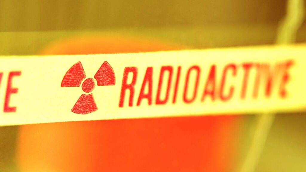 A faded label indicating a radioactive area.