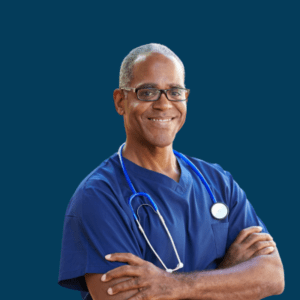 A hospital employee smiles while wearing blue scrubs.