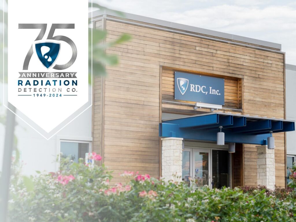 Radiation Detection Company headquarters in Georgetown, TX. A modern office building with a wooden facade featuring the RDC, Inc. logo above the entrance.