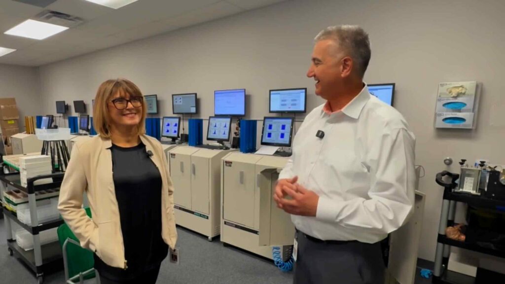 Mirela Kirr and Chris Passmore: Radiation Detection Company leadership discussing dosimetry services in the TLD processing laboratory
