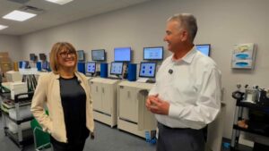 Mirela Kirr and Chris Passmore: Radiation Detection Company leadership discussing dosimetry services in the TLD processing laboratory